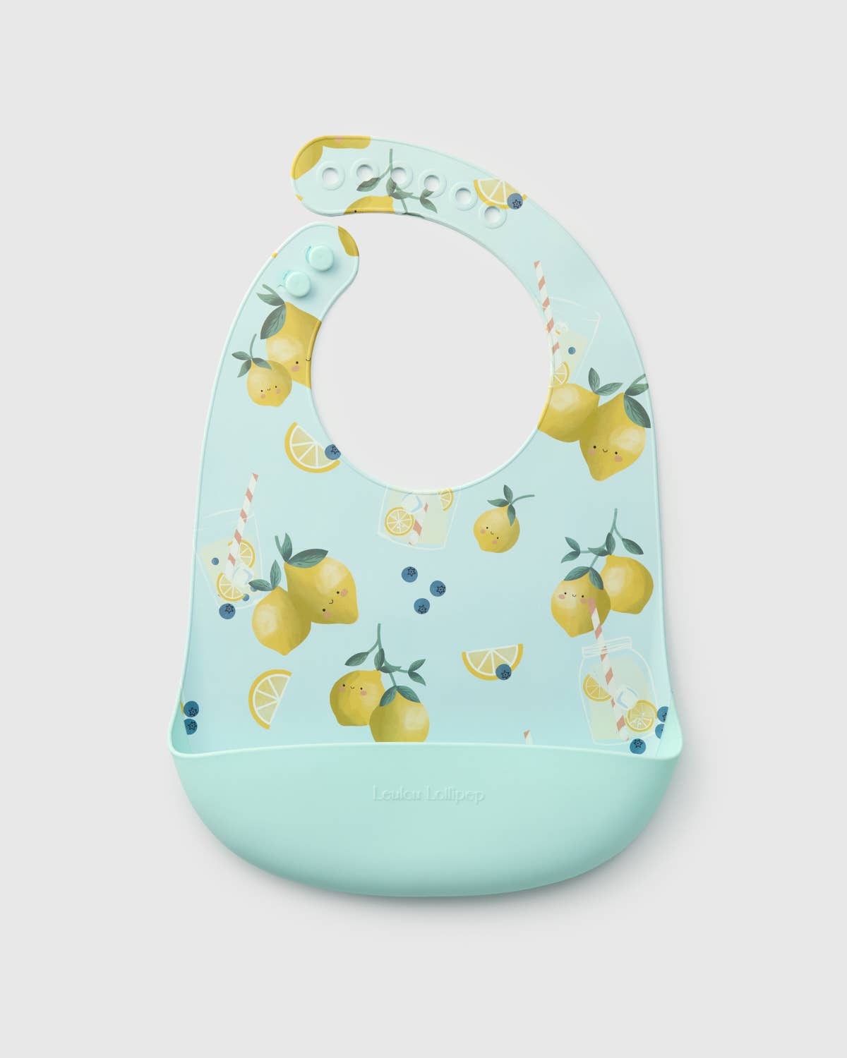 Baby bib with lemon pattern on a light blue background.