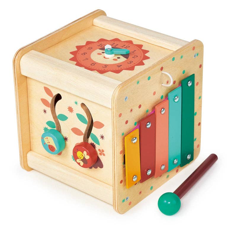 
                  
                    Wooden toy box with colorful design and mallet on a white background.
                  
                