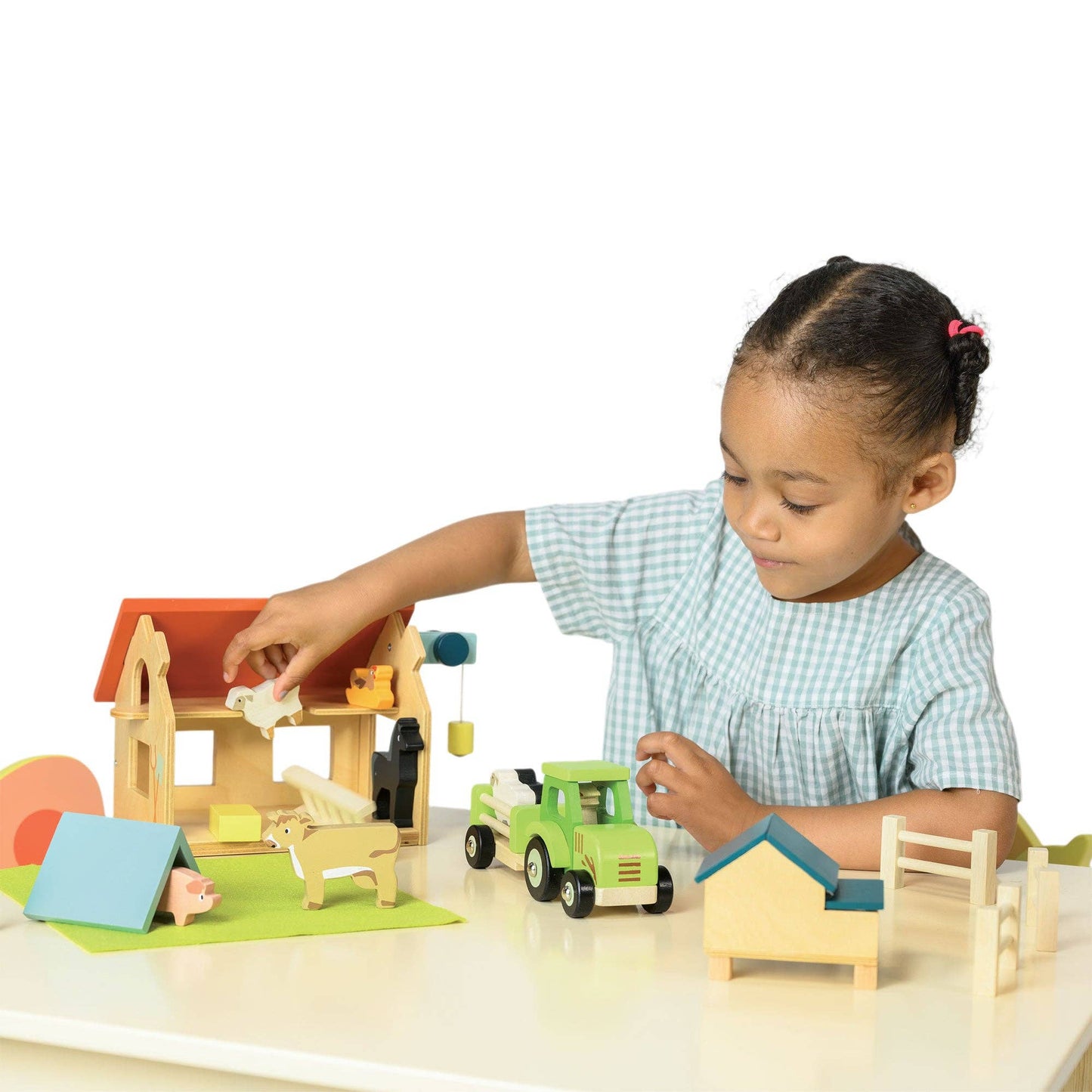 
                  
                    Child playing with a wooden toy set on a white background.
                  
                