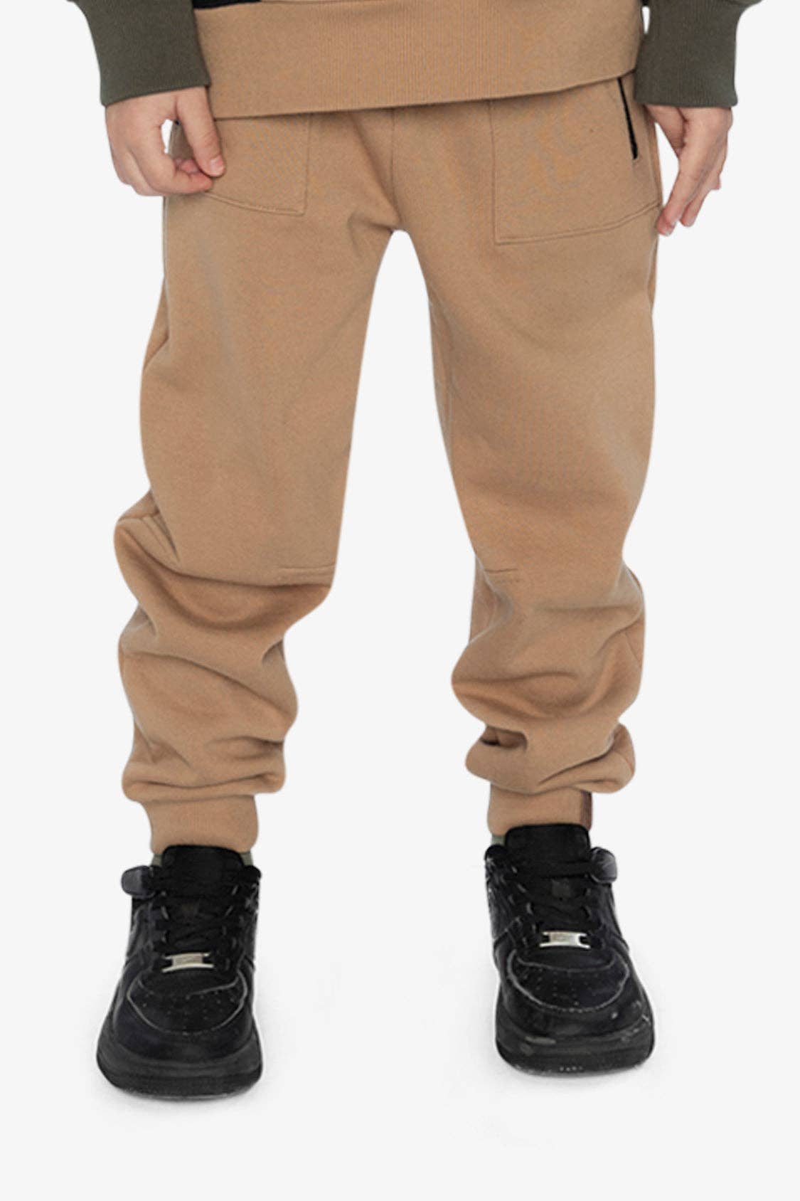 
                  
                    Tan pants worn by a person on a white background.
                  
                