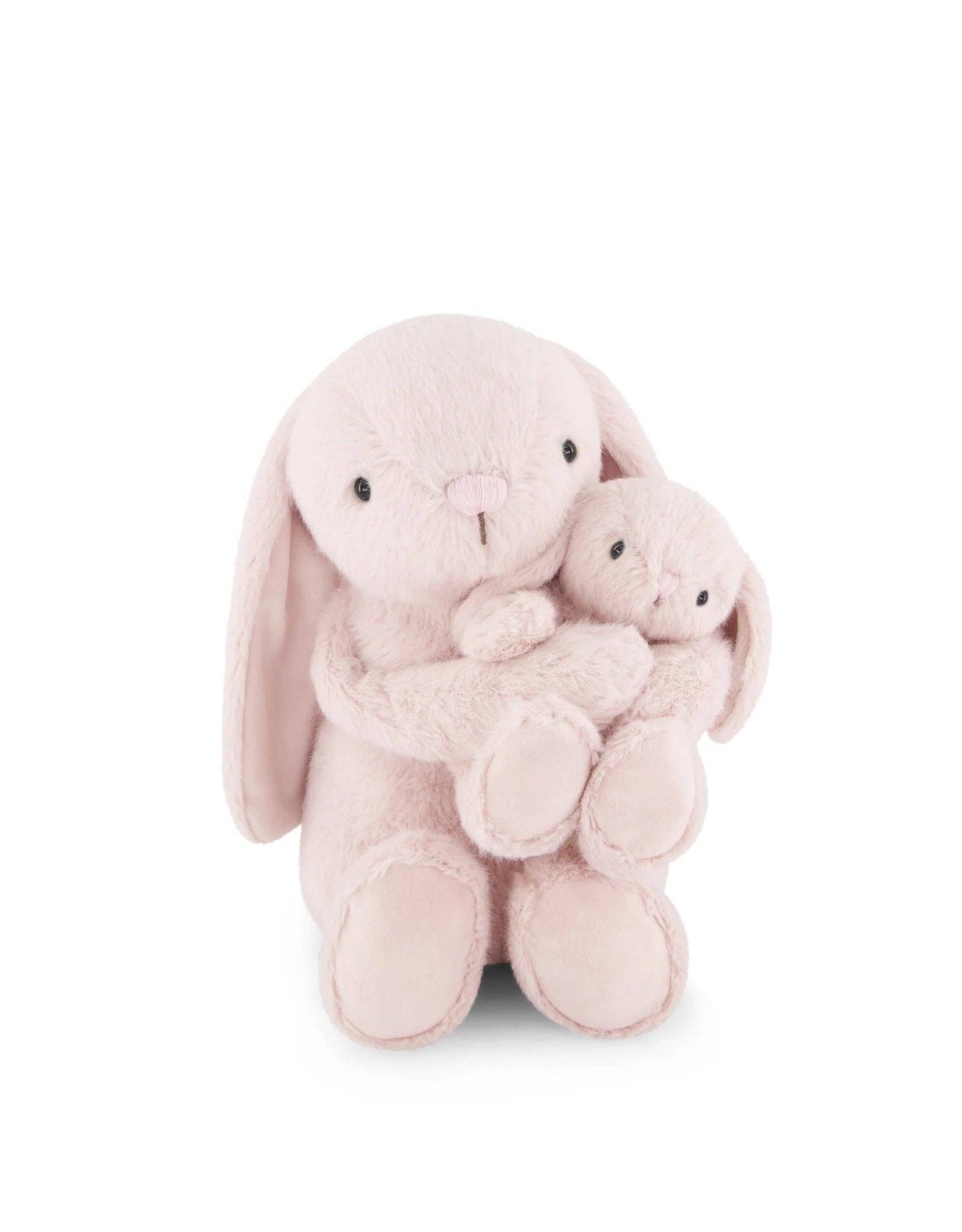 
                  
                    Two pink plush bunnies hugging each other on a white background.
                  
                
