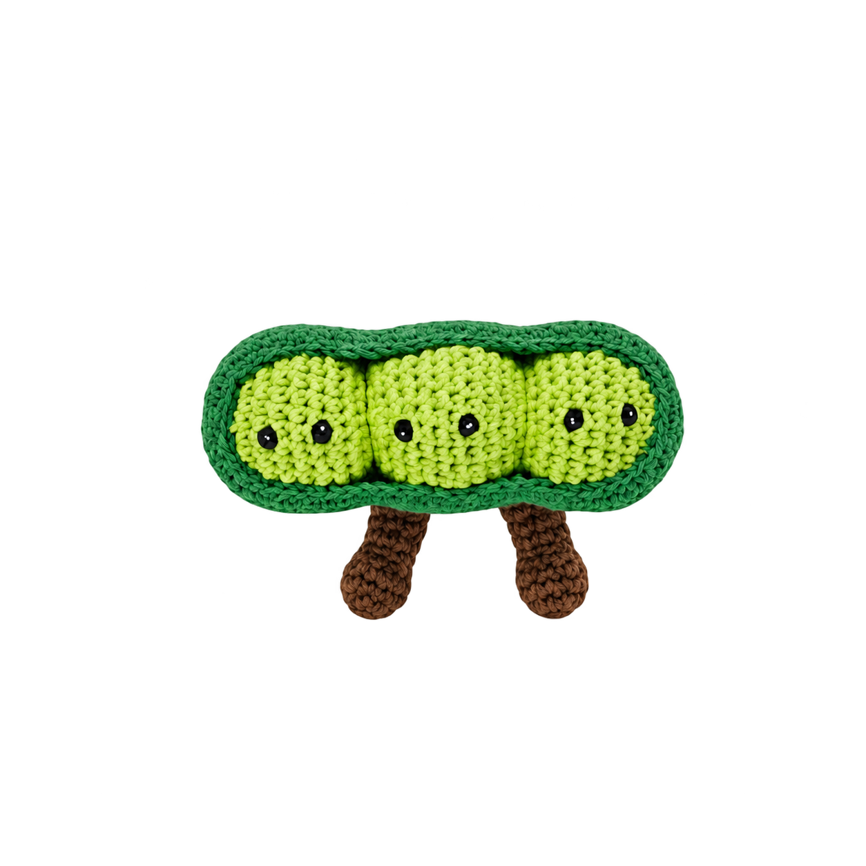 A crocheted plush toy shaped like a smiling green pea pod with three yellow-green peas inside, black eyes, and brown legs, centered on a plain white background.