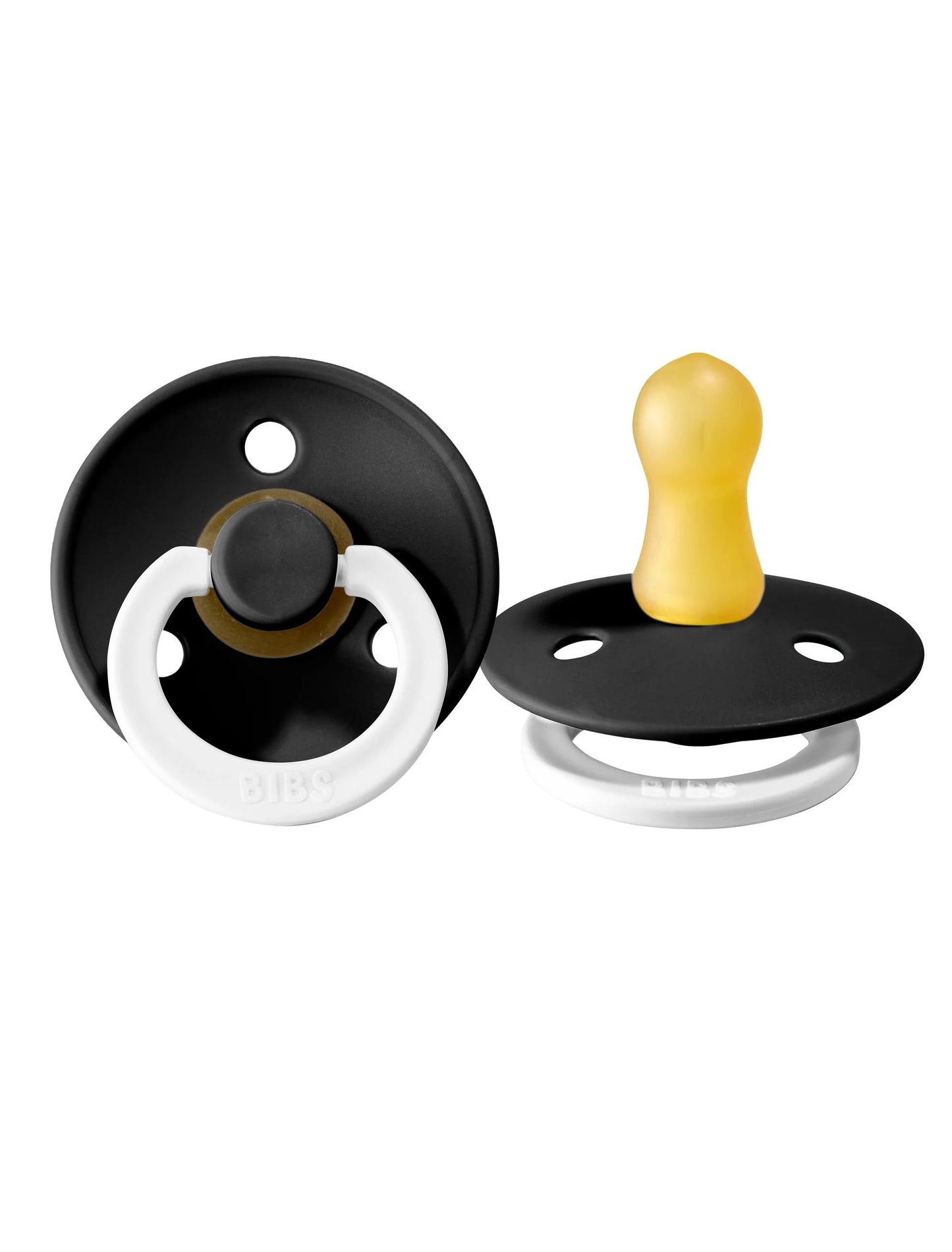 Two black and white pacifiers on a white background