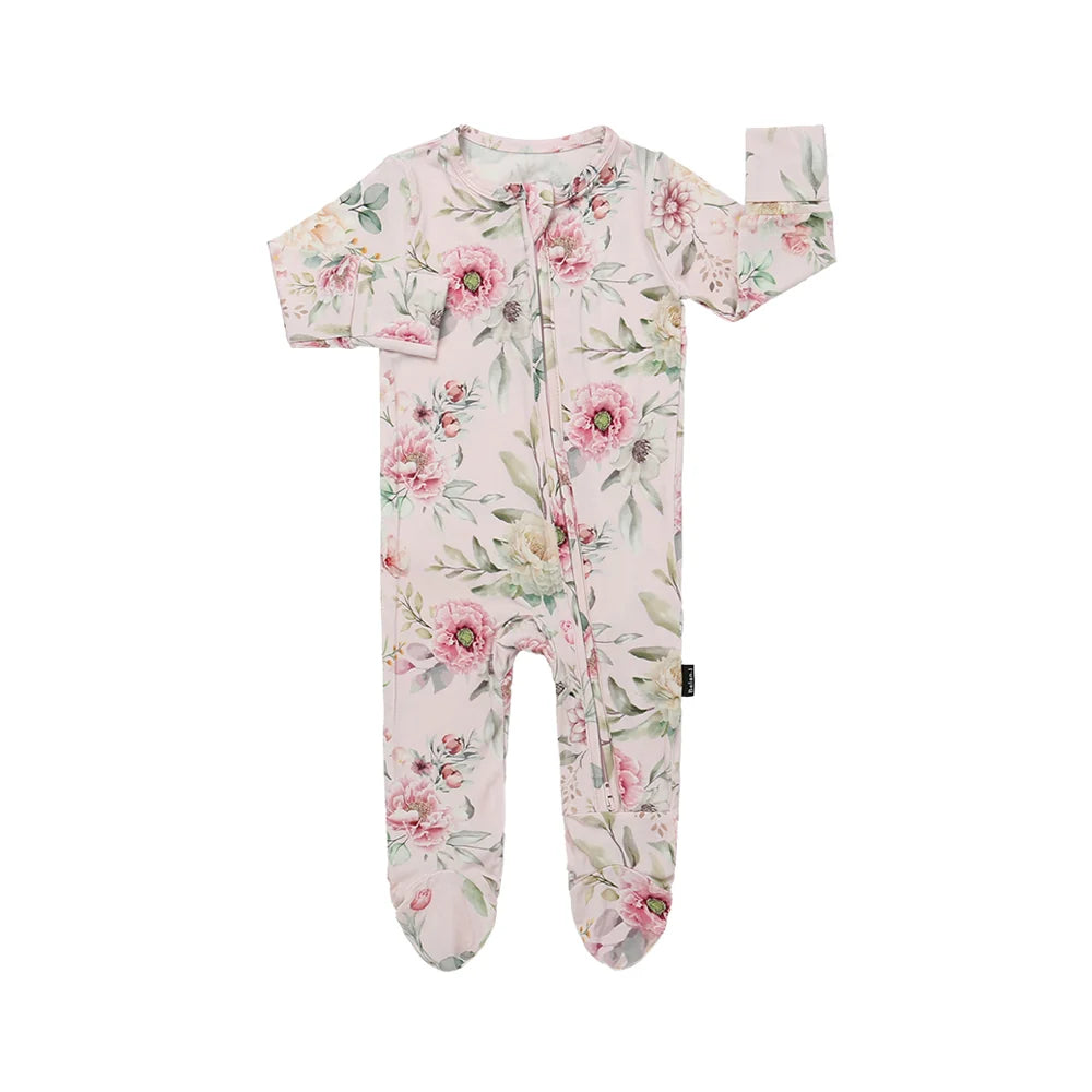 
                  
                    Floral patterned baby onesie on a white background.
                  
                