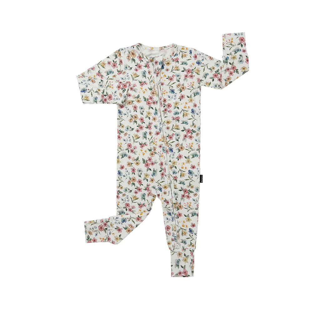 
                  
                    Floral-patterned baby onesie/sleeper in pastel colors on a white background.
                  
                