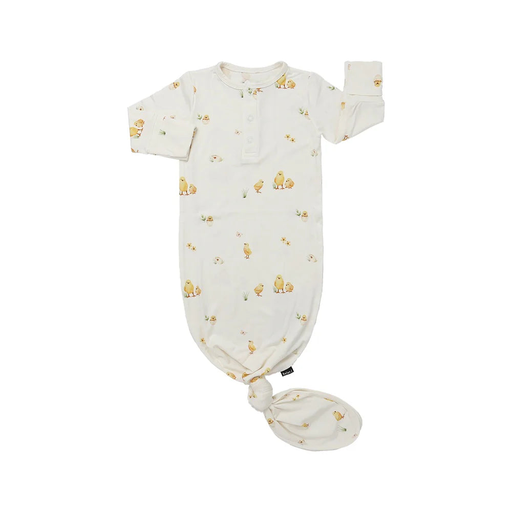 
                  
                    Baby sleep gown with yellow chicks pattern on a white background.
                  
                