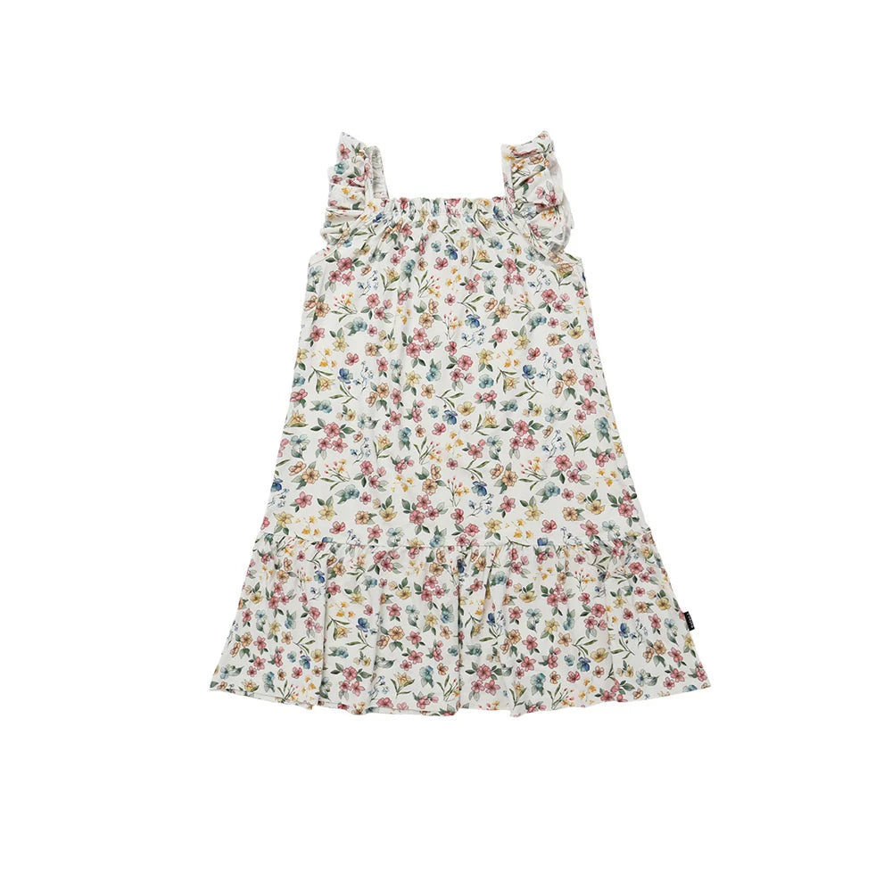 
                  
                    Floral dress in pastel colors on a white background.
                  
                