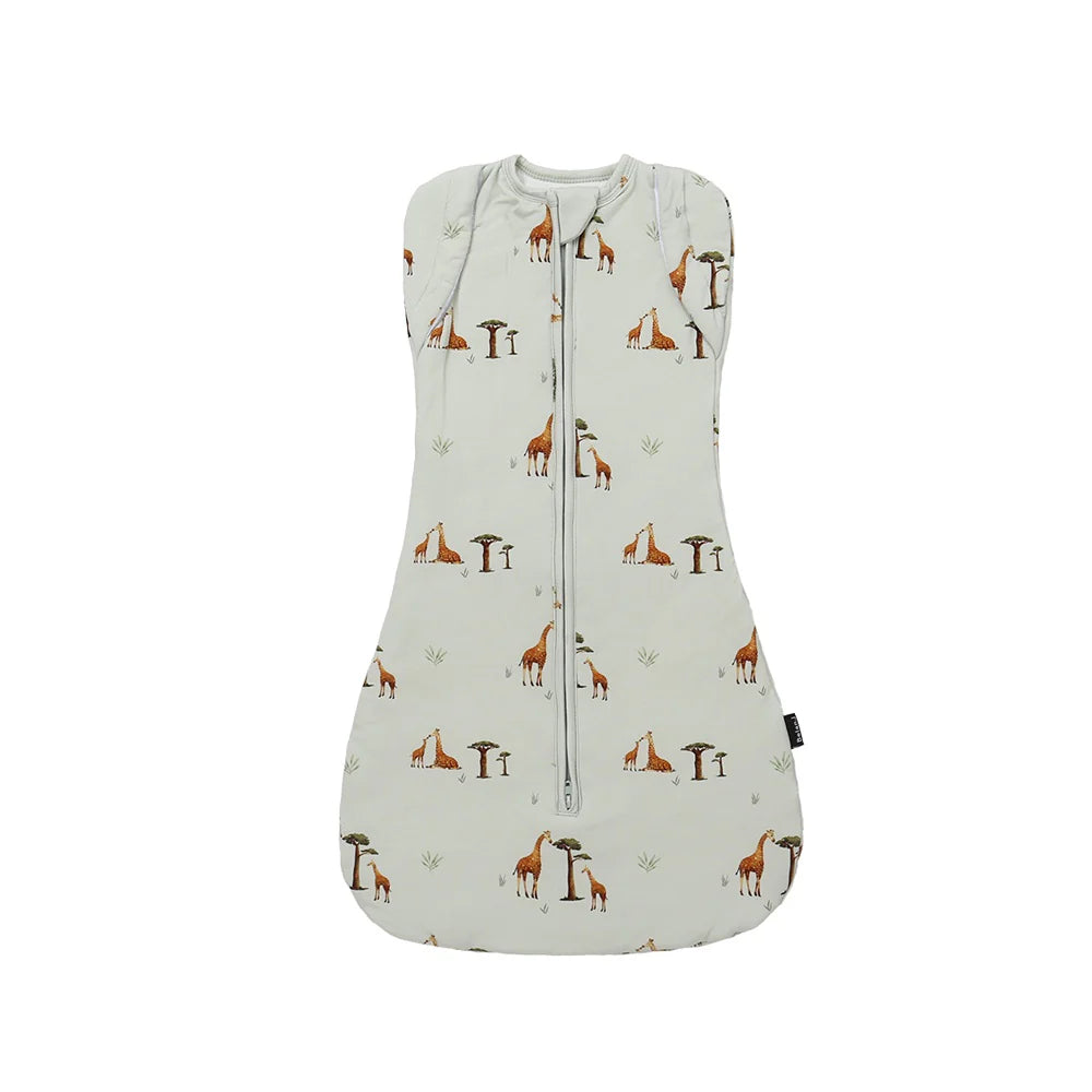 
                  
                    Baby light green swaddle sack with a giraffe pattern on a white background.
                  
                