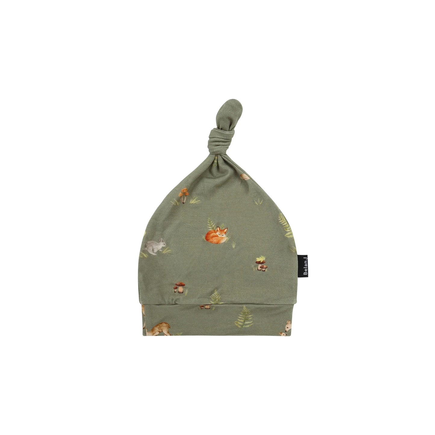 An olive green baby hat with a knotted top and a small-scale woodland print of foxes, rabbits, and mushrooms, shown on a plain white background.