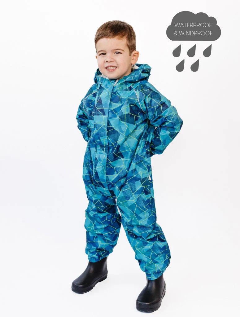 
                  
                    Child wearing a blue geometric-patterned waterproof suit on a white background
                  
                