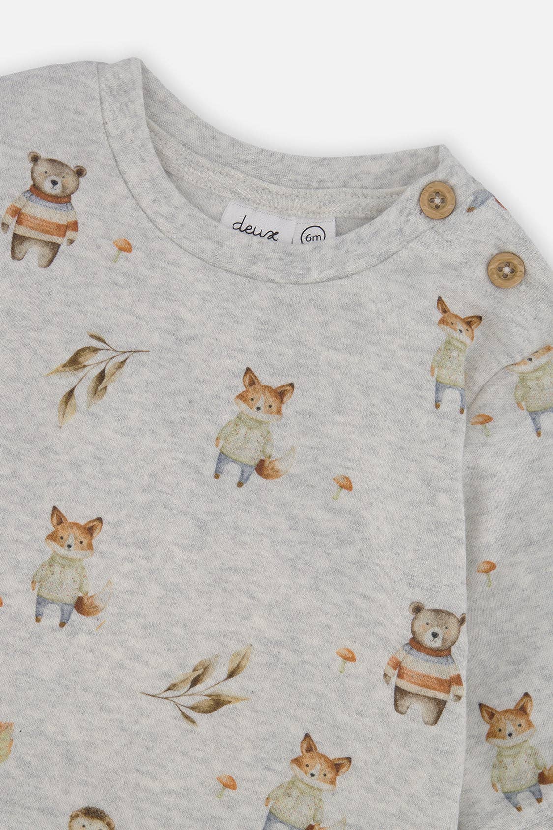 
                  
                    Gray long-sleeve shirt with fox and bear pattern on a white background.
                  
                