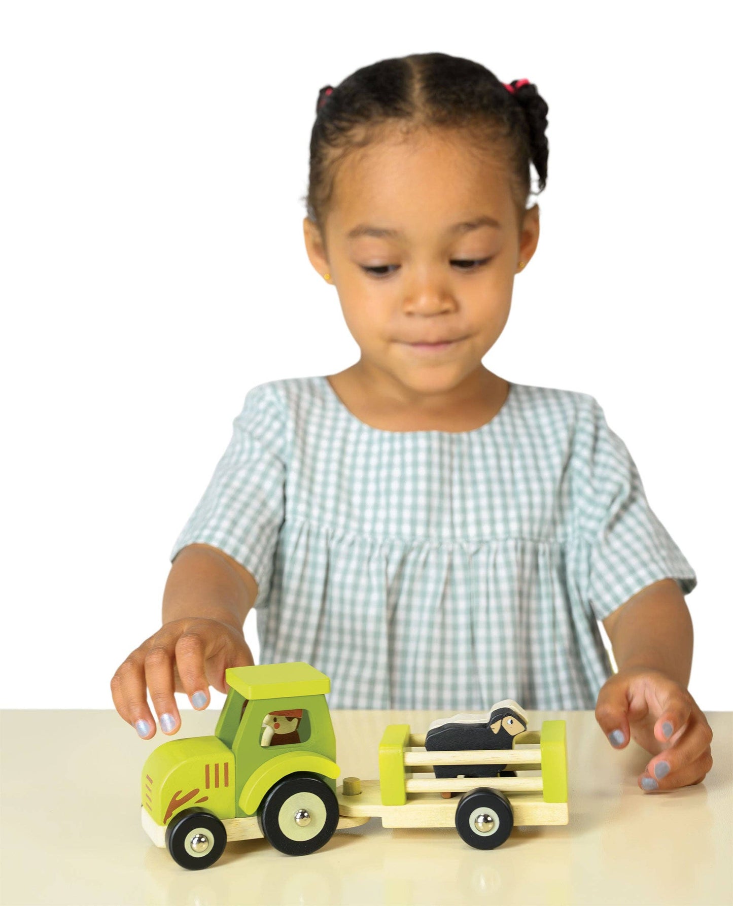 
                  
                    Child playing with a wooden toy truck on a white background.
                  
                