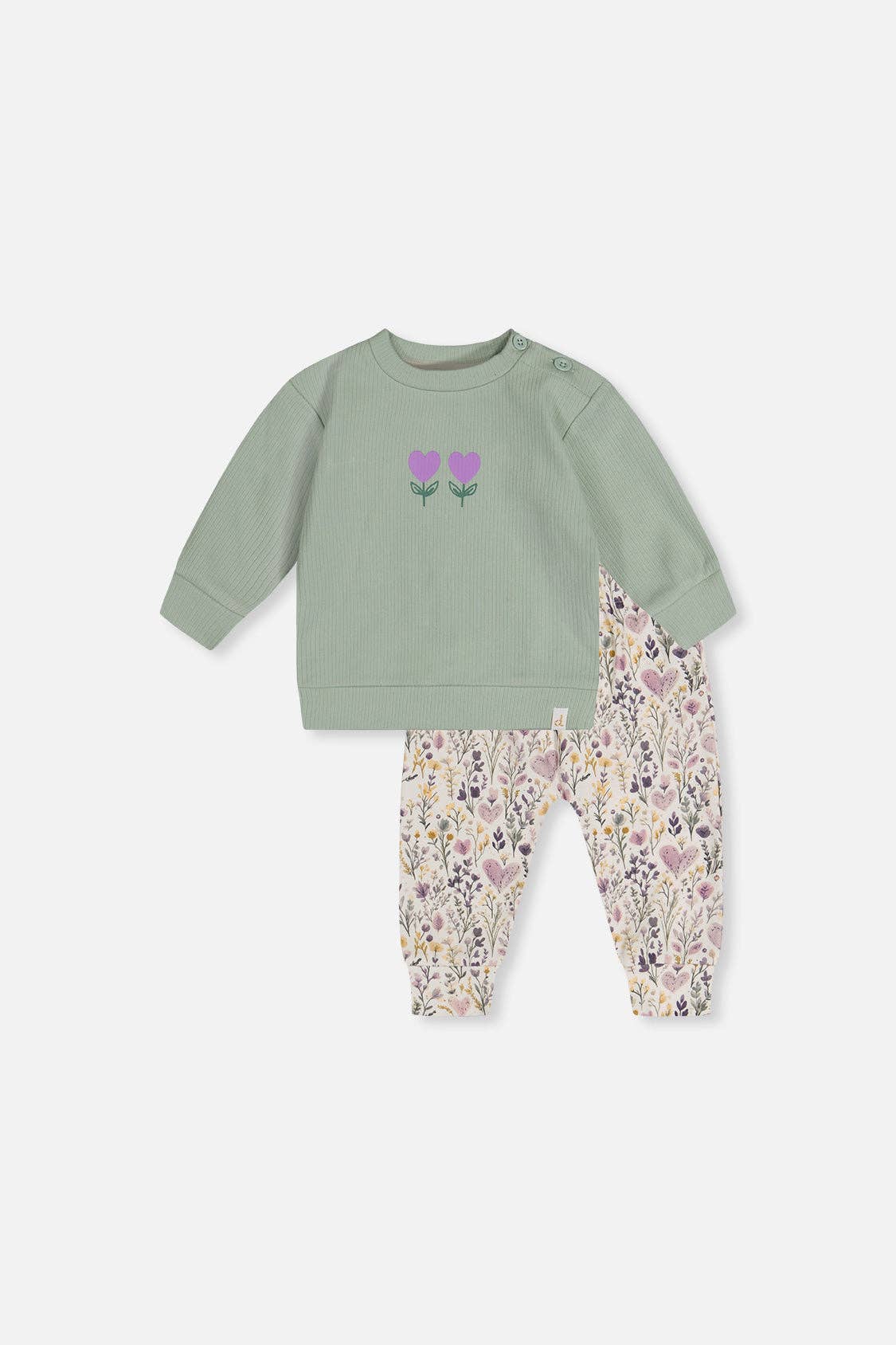 Children's outfit with green top and floral pants on a white background.