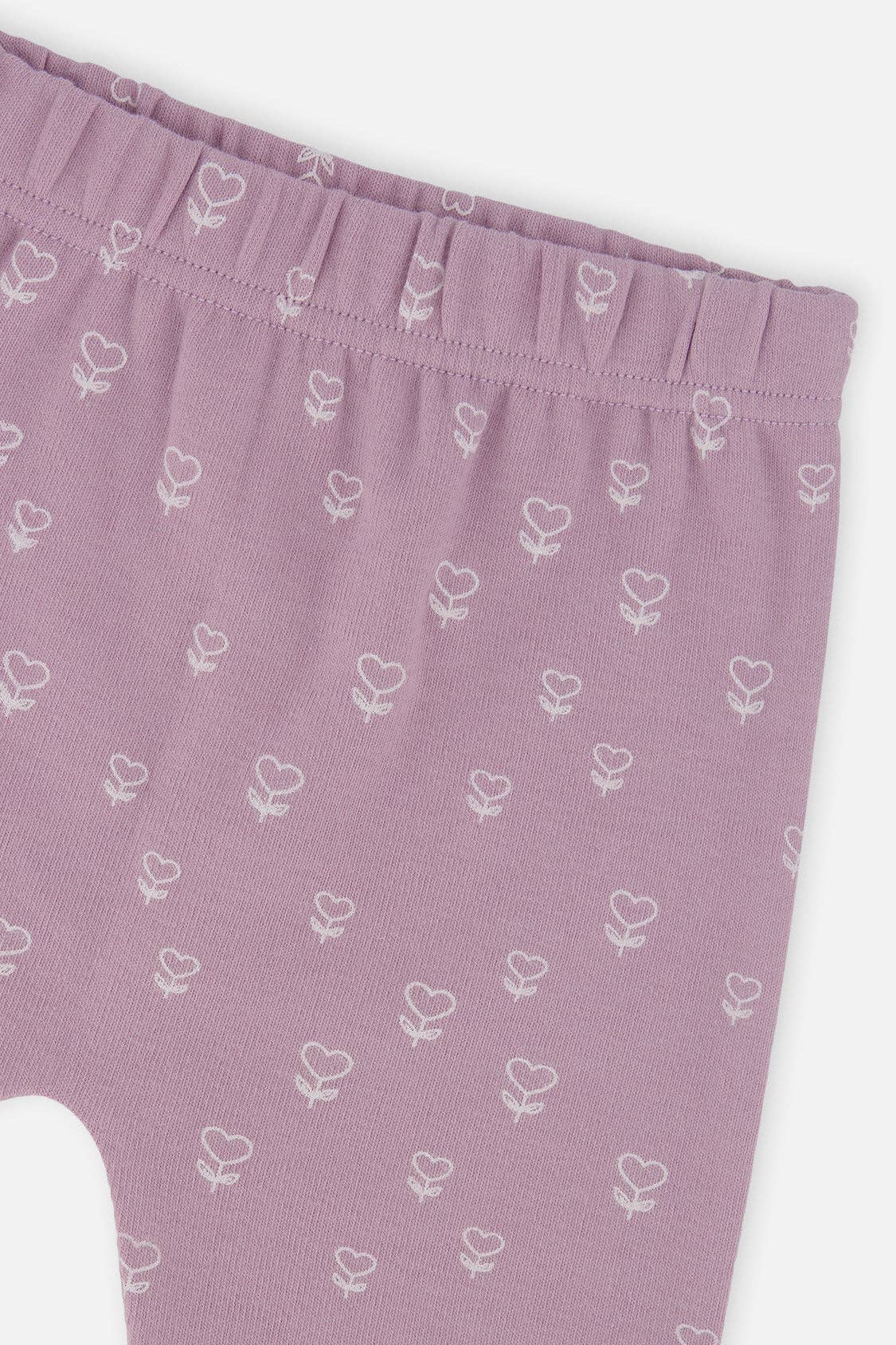 
                  
                    Purple baby leggings with white floral pattern on a white background.
                  
                