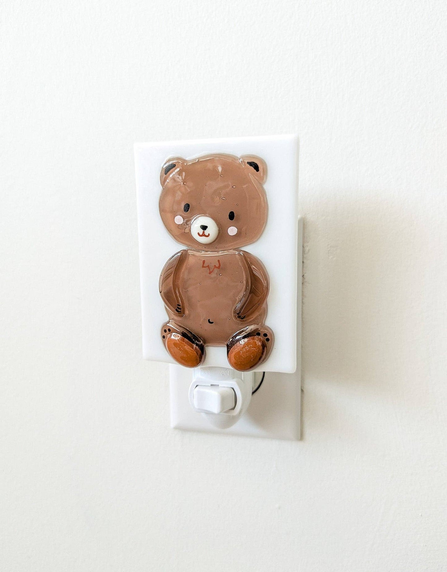 Teddy bear night light on a white background.